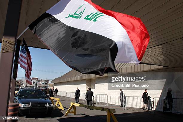 People enter a polling station to casts their ballot during voting for the Iraqi parliamentary election March 6, 2010 in Dearborn, Michigan. The...
