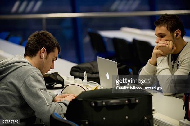 Alex De Angelis of San Marino and Scot Racing Team and Niccolo Canepa of Italy and Scot Racing Team wait in media center during the today morning for...