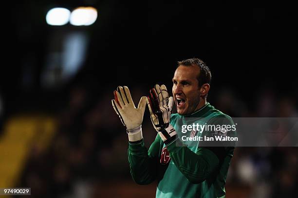 Mark Schwarzer the Fulham goalkeeper organises his defence during the FA Cup sponsored by E.ON Quarter Final match between Fulham and Tottenham...