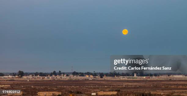 yellow moon over baghdad - baghdad skyline stock pictures, royalty-free photos & images