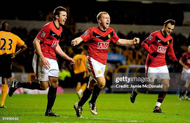 Paul Scholes of Manchester United celebrates scoring his team's first goal and his 100th Premier League goal during the Barclays Premier League match...