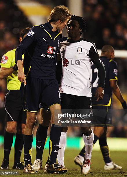 Peter Crouch of Tottenham Hotspur and Dickson Etuhu of Fulham argue during the FA Cup sponsored by E.ON Quarter Final match between Fulham and...