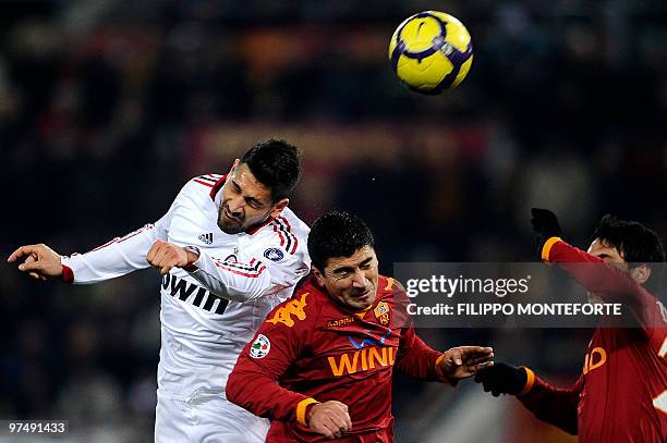 Milan's forward Marco Borriello fights for the ball with AS Roma chilean midfielder David Pizzarro during their Serie A football match in Rome's...