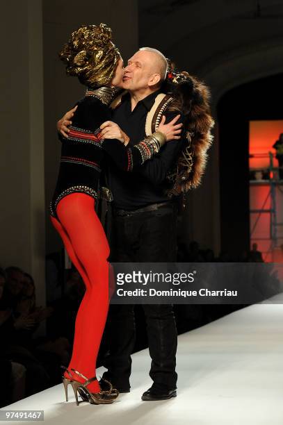 Designer Jean-Paul Gaultier and model Sasha Pivovarova greet each other at the end of the Jean-Paul Gaultier Ready to Wear show as part of the Paris...