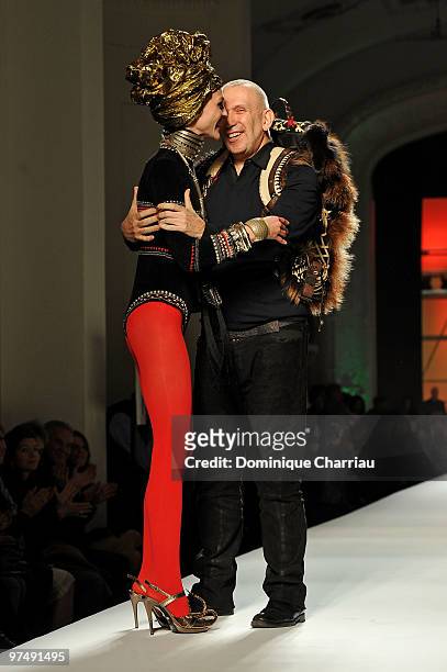 Designer Jean-Paul Gaultier and model Sasha Pivovarova greet each other at the end of the Jean-Paul Gaultier Ready to Wear show as part of the Paris...