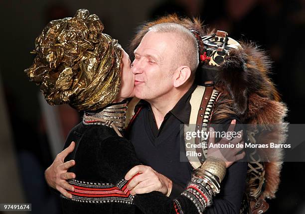 Designer Jean-Paul Gaultier and model Sasha Pivovarova greet each other on the runway at the end of the Jean-Paul Gaultier Ready to Wear show as part...