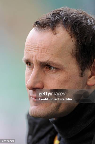 Heiko Herrlich, Head Coach of Bochum ponders during the Bundesliga match between VfL Wolfsburg and VfL Bochum at Volkswagen Arena on March 6, 2010 in...