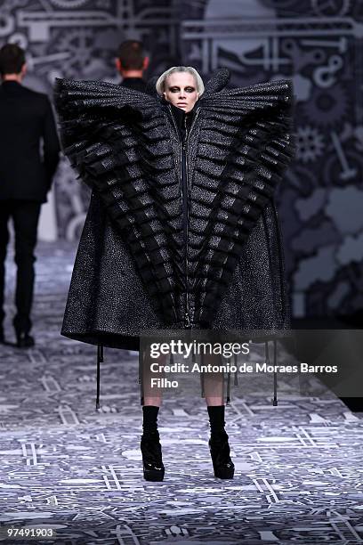 Model Kristen McMenamy performS during the Viktor & Rolf Ready to Wear show as part of the Paris Womenswear Fashion Week Fall/Winter 2011 at Espace...