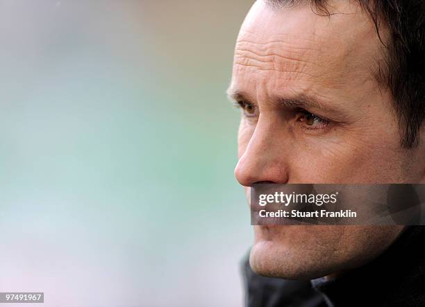 Heiko Herrlich, Head Coach of Bochum ponders during the Bundesliga match between VfL Wolfsburg and VfL Bochum at Volkswagen Arena on March 6, 2010 in...