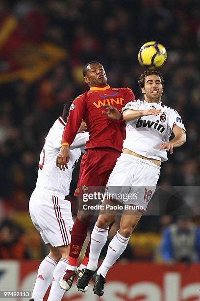 Julio Baptista of AS Roma and Flamini Mathieu of AC Milan compete for the ball during the Serie A match between AS Roma and AC Milan at Stadio...