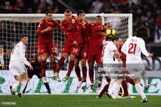 Andrea Pirlo of Milan curls a free kick over the Roma wall during the Serie A match between AS Roma and AC Milan at Stadio Olimpico on March 3, 2010...