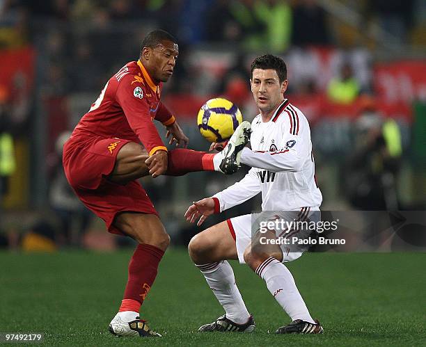 Julio Baptista of AS Roma and Daniele Bonera of AC Milan compete for the ball during the Serie A match between AS Roma and AC Milan at Stadio...