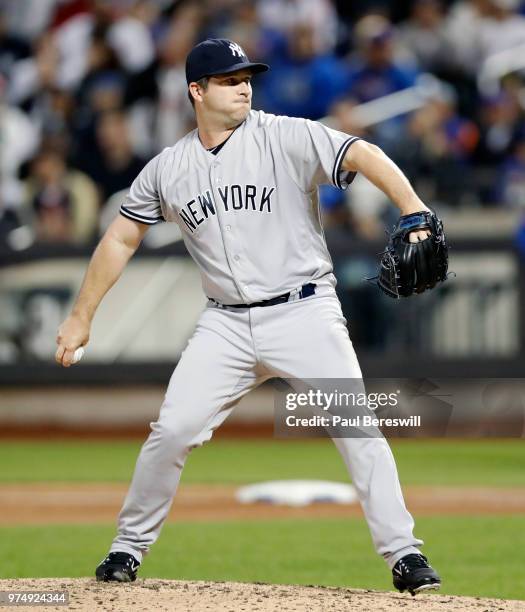 Adam Warren of the New York Yankees pitches during an MLB baseball game against the New York Mets at Citi Field in the Queens borough of New York...
