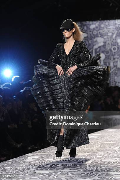 Model walks the runway during the Viktor & Rolf Ready to Wear Show as part of the Paris womens wear Fashion Week Fall Winter 2011 at Espace Ephemere...