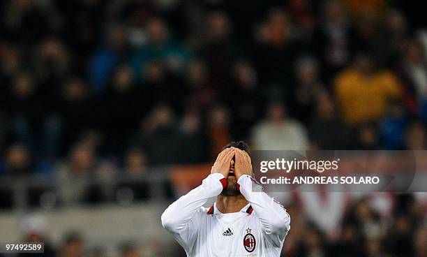 Milan's forward Marco Borriello reacts as he misses a goal against AS Roma during their Italian Series A football match on March 6, 2010 at Rome's...