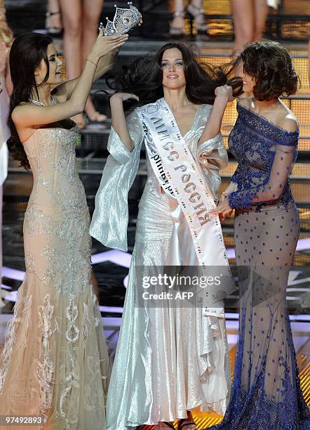 Newly-crowned Miss Russia 2010 Irina Antonenko receives her crown from Miss Russia 2009 Sofia Rudeva and Miss Universe Stefania Fernandez in Moscow...