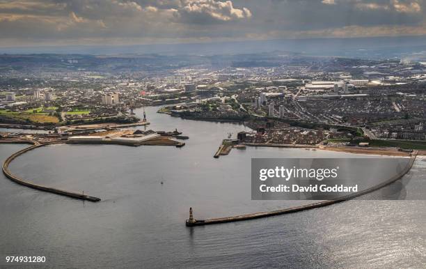 Aerial view of the Mouth of the River Wear, protected by the New South Pier and the Roker Pier, with the city of Sunderland in the background, in...