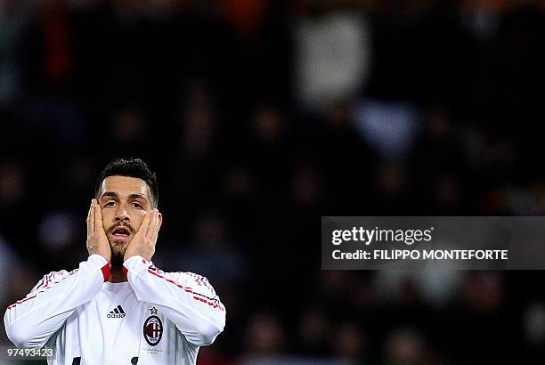 Milan's forward Marco Borriello reacts after a missed goal opportunity against AS Roma during their serie A football match in Rome's Olympic Stadium...