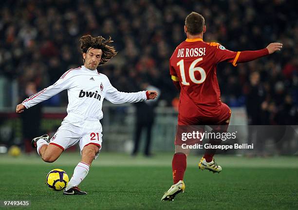 Andrea Pirlo of Milanand Daniele De Rossi of Roma in action during the Serie A match between AS Roma and AC Milan at Stadio Olimpico on March 6, 2010...