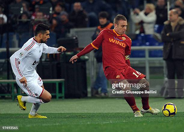Marco Borriello of Milan and Daniele De Rossi of Roma in action during the Serie A match between AS Roma and AC Milan at Stadio Olimpico on March 6,...