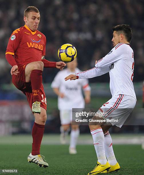 Daniele De Rossi of Roma and Marco Borriello of Milan in action during the Serie A match between AS Roma and AC Milan at Stadio Olimpico on March 6,...
