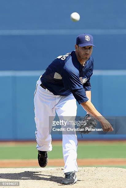 Starting pitcher Jon Garland of the San Diego Padres pitches against the Seattle Mariners during the MLB spring training game at Peoria Stadium on...