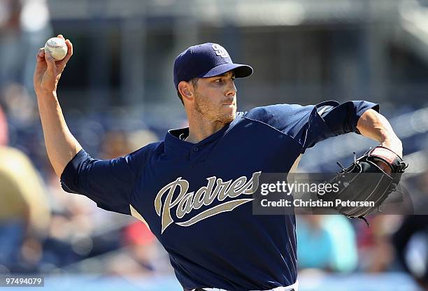 Starting pitcher Jon Garland of the San Diego Padres pitches against the Seattle Mariners during the MLB spring training game at Peoria Stadium on...