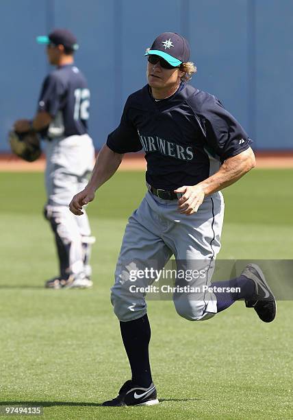 Eric Byrnes of the Seattle Mariners warms up before the MLB spring training game against the San Diego Padres at Peoria Stadium on March 6, 2010 in...