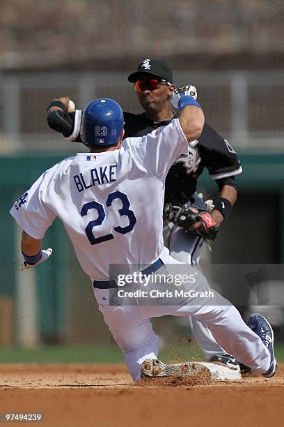 Casey Blake of the Los Angeles Dodgers is out as he slides into second as Alexei Raqmirez of the Chicago White Sox throws to first base during a...