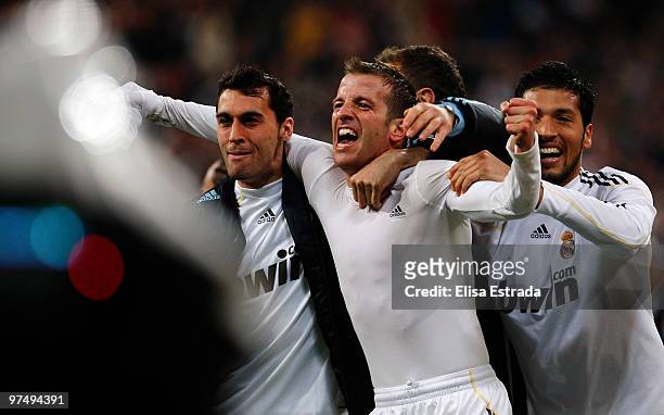 Rafael Van der Vaart of Real Madrid celebrates with Alvaro Arbeloa and Ezequiel Garay after scoring during the La Liga match between Real Madrid and...