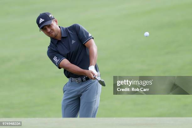 Xander Schauffele of the United States chips to the fifth green during the first round of the 2018 U.S. Open at Shinnecock Hills Golf Club on June...