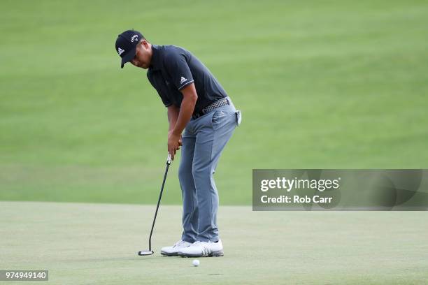 Xander Schauffele of the United States putts on the fifth green during the first round of the 2018 U.S. Open at Shinnecock Hills Golf Club on June...