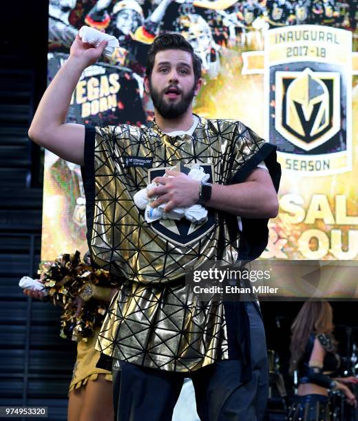 Member of the Knights Crew throws T-shirts to fans during the Vegas Golden Knights' "Stick Salute to Vegas and Our Fans" event at the Fremont Street...