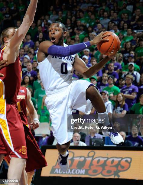 Guard Jacob Pullen of the Kansas State Wildcats drives around pressure towards the basket in the first half against the Iowa State Cyclones on March...