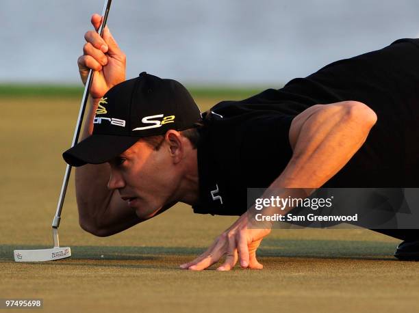 Camilo Villegas of Colombia looks over a putt on the 18th hole during the third round of the Honda Classic at PGA National Resort And Spa on March 6,...
