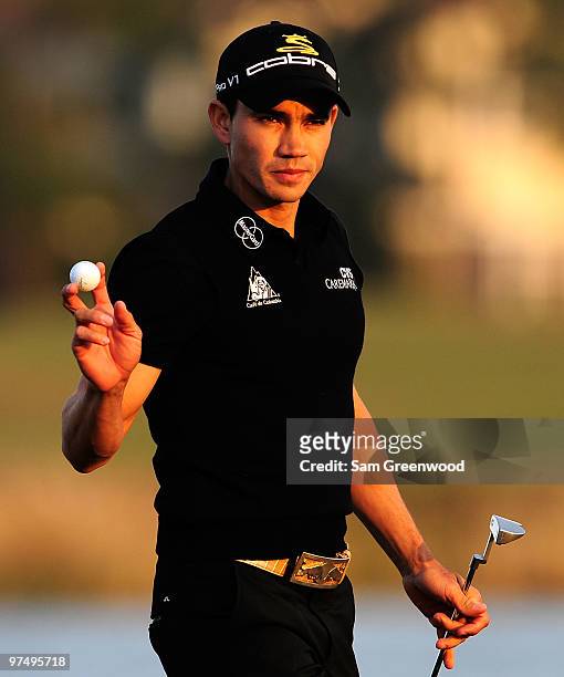 Camilo Villegas of Colombia reacts to a par putt on the 18th hole during the third round of the Honda Classic at PGA National Resort And Spa on March...