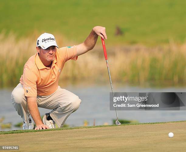 Jerry Kelly looks over a putt on the 11th hole during the third round of the Honda Classic at PGA National Resort And Spa on March 6, 2010 in Palm...