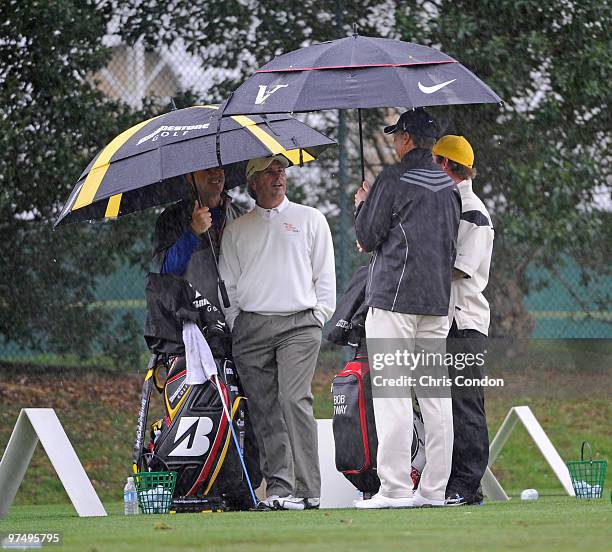 Fred Couples and Bob Tway wait out the rain delay during the second round of the Toshiba Classic at Newport Beach Country Club on March 6, 2010 in...