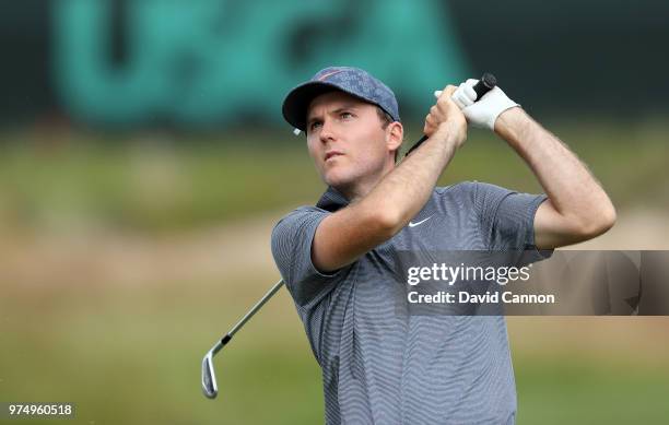 Russell Henley of the United States plays his tee shot on the 17th hole during the first round of the 2018 US Open at Shinnecock Hills Golf Club on...