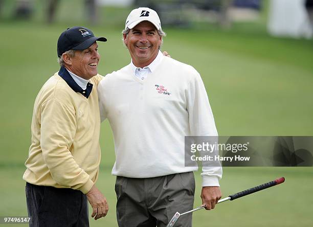 Fred Couples and Wayne Levi laugh on the 18th green during the second round of the Toshiba Classic at the Newport Beach Country Club on March 6, 2010...