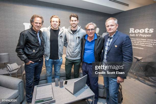 Roots co-founder Don Green, left to right, Bruins Players Charlie McAvoy, Adam McQuaid, Roots cofounder Michael Budman, and Roots President and CEO...