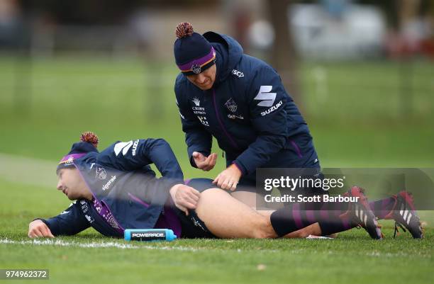 Billy Slater of the Storm is treated as he performs a fitness test during a Melbourne Storm NRL training session at Gosch's Paddock on June 14, 2018...