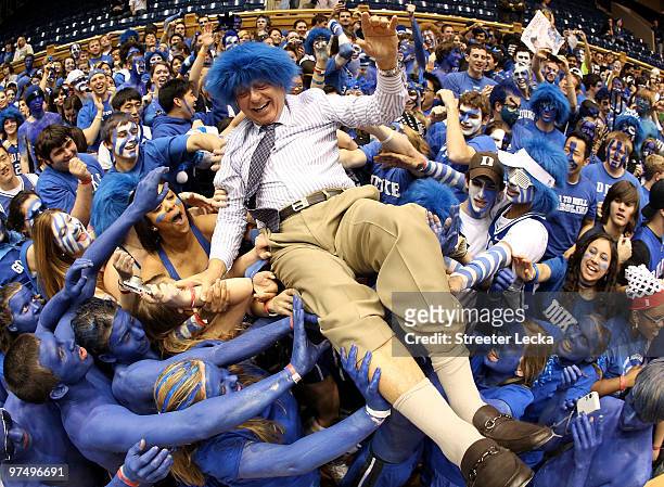 Analyst Dick Vitale surfs the crowd with the Cameron Crazies before the start of the game between the North Carolina Tar Heels and Duke Blue Devils...