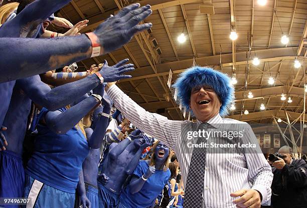 Analyst Dick Vitale celebrates with the Cameron Crazies before the start of the game between the North Carolina Tar Heels and Duke Blue Devils at...