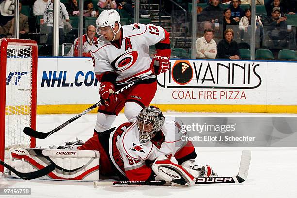 Goaltender Justin Peters of the Carolina Panthers defends the net with the help of teammate Ray Whitney against the Florida Panters at the...