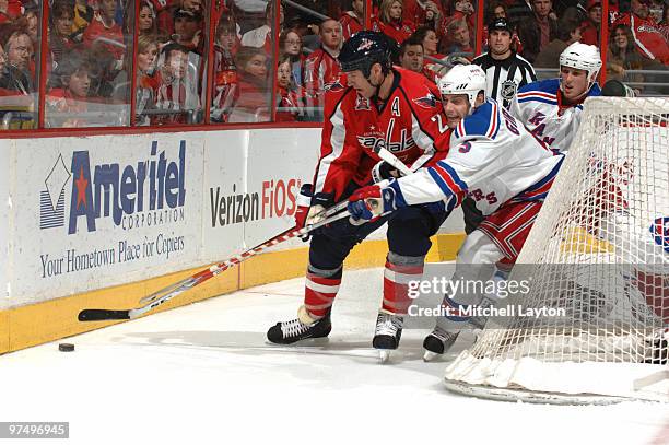Mike Knuble of the Washington Capitals controls the puck during a NHL hockey game against Dan Girardi of the New York Rangers on March 6, 2010 at the...
