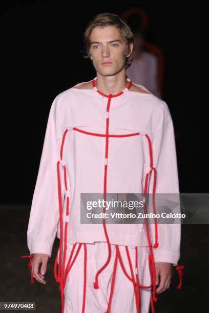 Model walks the runway at the Craig Green show during the 94th Pitti Immagine Uomo on June 14, 2018 in Florence, Italy.