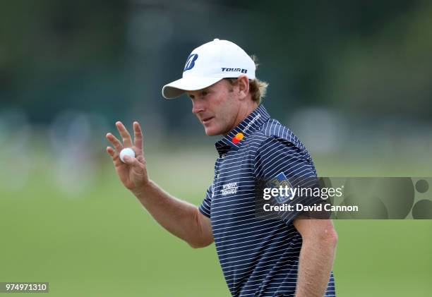 Brandt Snedeker of the United States acknowledges the crowds after holing out for par on the 16th hole during the first round of the 2018 US Open at...