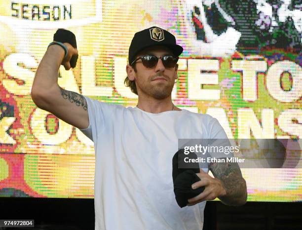 James Neal of the Vegas Golden Knights throws T-shirts to the crowd as he is introduced at the team's "Stick Salute to Vegas and Our Fans" event at...