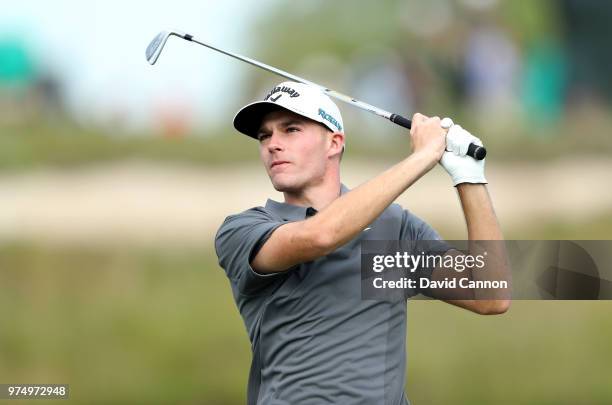 Aaron Wise of the United States plays his tee shot on the 17th hole during the first round of the 2018 US Open at Shinnecock Hills Golf Club on June...